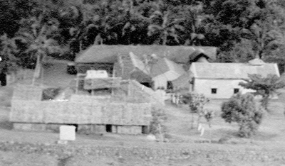 The Mother's Temple, with its thatched roof, is the building furthest away from the camera. It existed in this state for about ten years.