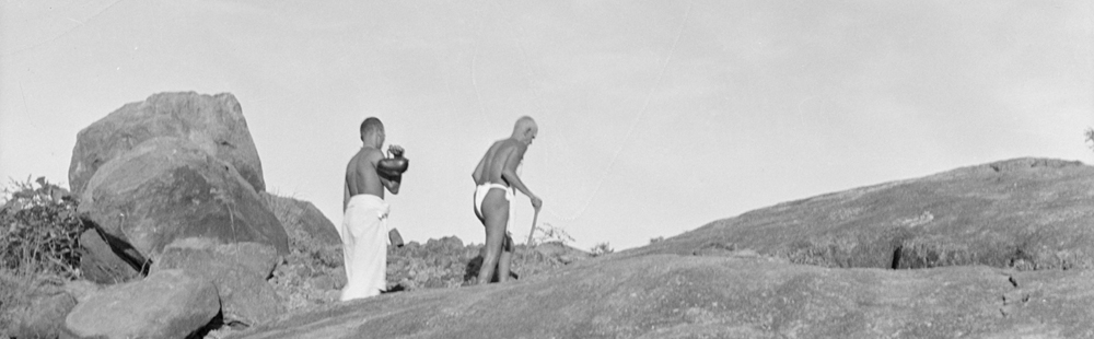 Bhagavan walking on Arunachala with his attendant