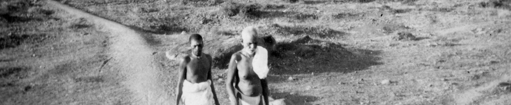 Bhagavan walking on Arunachala with his attendant.