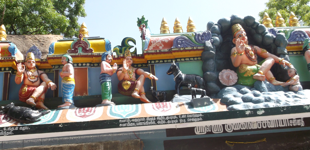 The story of Guhai Namasivaya and the goats retold in statues above the entrance to his samadhi shrine. The images of Guha (on the right) is based on a granite bas-relief that contains the only known image of Guhai Namasivaya