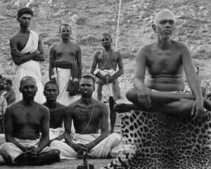 Ramakrishna Swami, sitting between Muruganar and Perumal Swami, taken at Ramanasramam in 1923.