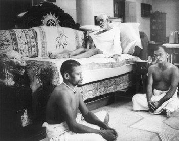 Bhagavan sitting on his sofa in the new hall