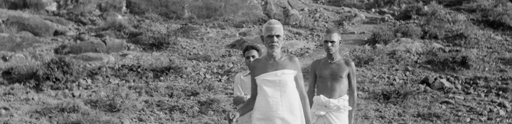 Bhagavan walking on the hill with his attendant
