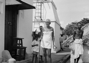 Annamalai Swami, Madhava Swami and Bhagavan putside Bhagavan's bathroom in the 1930s