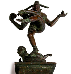 A bronze statue depicting Nataraja stamping on Muyalakan