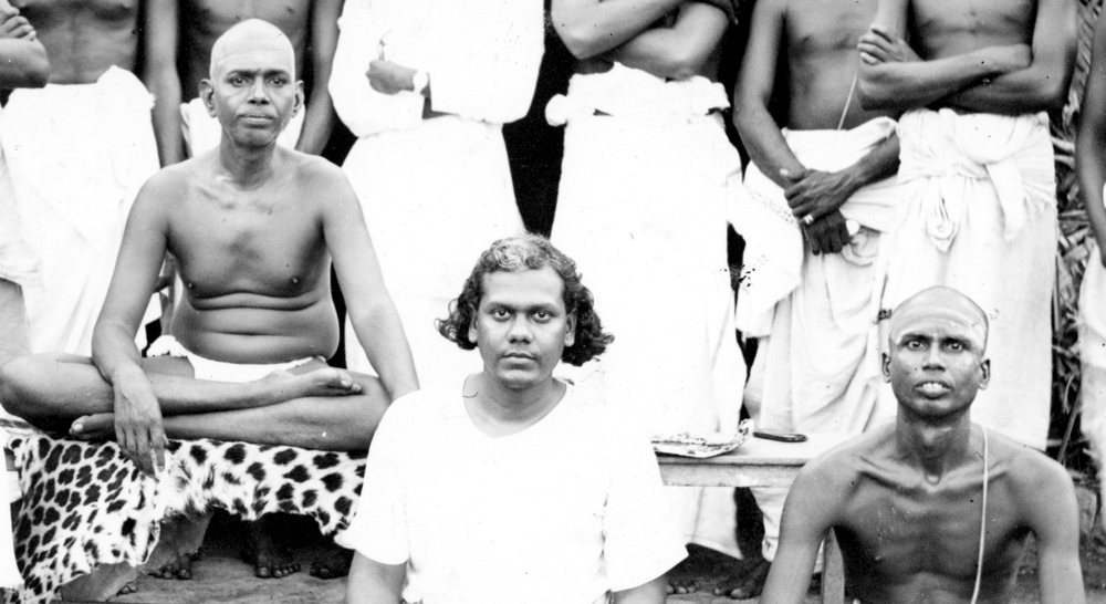 Muruganar (right) sitting with Bhagavan