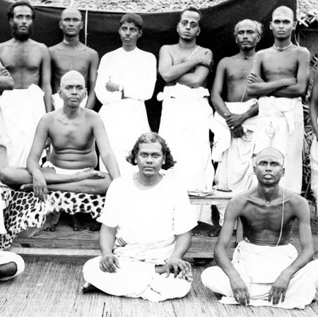 Muruganar sitting front right